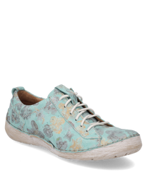 The turquoise lace-up shoe impresses with a floral pattern in gray and yellow. The upper material is made of a textured textile that gives the shoe a unique handcrafted appearance.