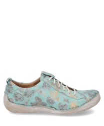 The turquoise lace-up shoe impresses with a floral pattern in gray and yellow. The upper material is made of a textured textile that gives the shoe a unique handcrafted appearance.