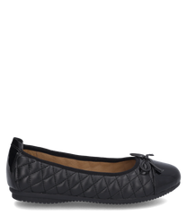 An elegant black ballerina shoe made of quilted material without closure. The shoe features a decorative bow on the front and a flat sole for comfort.