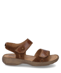 The sandal shown is in a warm brandy color and is made of shiny leather. It features a practical Velcro closure that ensures a comfortable fit.