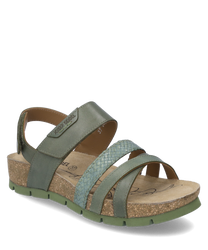 Sandalo verde con chiusura in velcro realizzato in pelle liscia e cinturino intrecciato. La suola è in sughero con una suola in gomma antiscivolo.