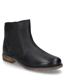 La bota negra está hecha de cuero de alta calidad y presenta una superficie elegante y lisa. Está equipada con una práctica cremallera que permite ponerla y quitarla fácilmente.
