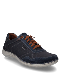 De halfhoge schoen in de kleur indigo-combinatie is gemaakt van een gestructureerde stof met gladde donkerblauwe accenten. Hij heeft een vetersluiting en een lichtgrijze zool die zorgt voor een sportieve uitstraling.