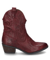 La bota color burdeos está hecha de cuero suave y tiene una moderna cremallera en el costado. El zapato se caracteriza por su elegante tacón curvado y las costuras decorativas.