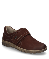 La chaussure basse en marron foncé est en cuir et dispose d'une fermeture velcro. La semelle claire avec profil et les coutures décoratives donnent à la chaussure un look sport-chic.