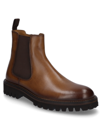 Die Stiefelette aus glattem braunem Leder hat einen seitlichen Reißverschluss für einfaches Anziehen. Sie besticht durch ihre robuste Gummisohle und elastische Einsätze für zusätzlichen Komfort.