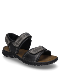 Sandalo nero con chiusura in velcro realizzato in pelle robusta. La suola è imbottita e offre un elevato comfort di calzata ideale per l'uso quotidiano.