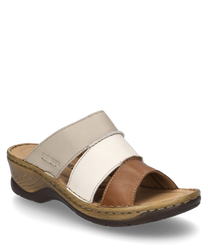 The clog in cognac-multi features an elegant design with a material mix of various light and dark brown tones. The shoe has a practical elastic band and a sturdy sole for added comfort.