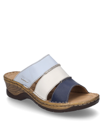 Un zueco en color Ocean-Multi con cierre de goma compuesto por varios tonos de azul claros y oscuros. El zapato tiene una suela robusta y una zona de dedos abierta y cómoda.