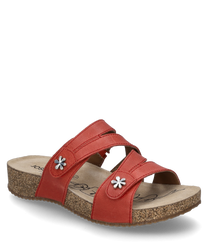 Sandalia roja con cierre de velcro hecha de cuero con flores de metal decorativas. Suela de corcho cómoda para un confort óptimo ideal para el uso diario.