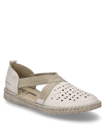 An off-white half shoe with elastic rubber band closure made from a soft fabric material. The shoe features a unique hole pattern on the upper side and a durable sole.