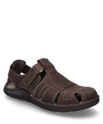 La sandalo color mocca è realizzato in pelle di alta qualità e ha una pratica chiusura in velcro. Si distingue per la sua struttura aperta e le delicate cuciture decorative che offrono ulteriore comfort e stile.