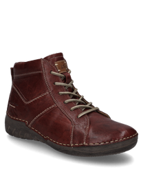 Stivaletti in pelle marrone con un caratteristico lacci e cuciture a contrasto. Offrono una suola robusta e strutturata ideale per un look casual ma stiloso.