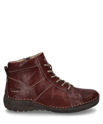 Stivaletti in pelle marrone con un caratteristico lacci e cuciture a contrasto. Offrono una suola robusta e strutturata ideale per un look casual ma stiloso.