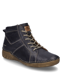 Bottine en cuir bleu foncé avec lacets semelle robuste et beige clair. Les caractéristiques particulières sont les coutures décoratives et l'impression de la marque sur le côté.