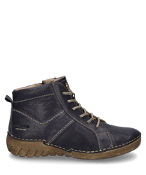 Bottine en cuir bleu foncé avec lacets semelle robuste et beige clair. Les caractéristiques particulières sont les coutures décoratives et l'impression de la marque sur le côté.