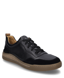 La sneaker noire avec lacets est fabriquée en cuir de haute qualité et en détails en daim. Elle possède une semelle beige qui crée un contraste moderne.