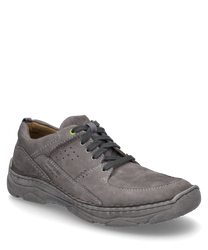 The shoe is a low-cut style with a lacing closure made from grey suede material. It features subtle stitching details and a comfortable sole designed for everyday wear.