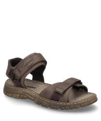 Sandalo marrone con chiusura in velcro realizzato in pelle robusta. Il sandalo offre una soletta imbottita per un comfort aggiuntivo.