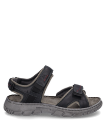 The sandal is made of black leather with gray accents and features a practical Velcro closure. The sturdy gray sole provides good grip while red stitching serves as a subtle design feature.