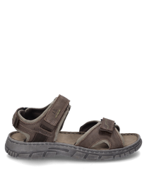 Brown sandal with Velcro closure made from durable leather. The sole is gray and textured for better grip.
