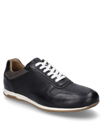 Elegant lace-up shoe made of black leather with white laces and a contrasting beige sole. The shoe features a subtle perforated pattern on the surface and a padded collar for extra comfort.
