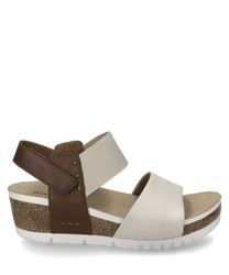 Beige sandal with Velcro closure made of a beige textile and a brown leather strap. The sandal features a comfortable cork sole with white profiling and offers a modern casual look.