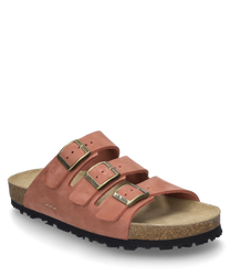 The sandal is made of red suede and features three adjustable metal buckles. The sole is made of light brown cork providing comfort and stability.