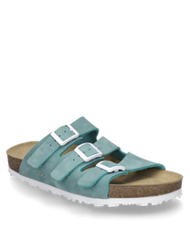 The sandal is made of turquoise suede and features three adjustable buckles as a closure. It has a comfortable cork sole and a white profiled outsole for additional grip.