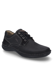 The shoe is black and made of a sturdy material ideal for everyday use. It features lacing and striking white stitching as a special detail.