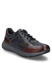 La sneaker nella variante di colore 'ocean-multi' è realizzata in pelle di alta qualità che presenta tonalità di blu e marrone. Caratteristiche particolari sono la chiusura con lacci e i dettagli di colore a contrasto che conferiscono alla scarpa un aspett