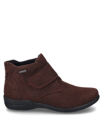 La botte illustrée est de couleur bordeaux profond et est fabriquée en matériau doux et mat. Elle dispose d'une fermeture velcro pratique et de coutures décoratives discrètes qui ajoutent une touche d'élégance à la chaussure.