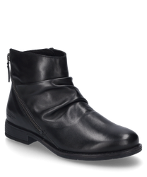 The black ankle boot is made of shiny leather and features a side zipper. The shoe is characterized by its simple design and a slightly gathered texture.