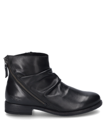 The black ankle boot is made of shiny leather and features a side zipper. The shoe is characterized by its simple design and a slightly gathered texture.