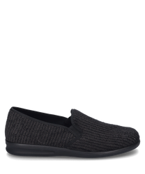 A black house slipper with a woven pattern and elastic closure. The shoe is made of a soft flexible material and provides a comfortable fit.