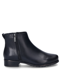 Dark blue ankle boot made of shiny material with a side zipper. The shoe has a flat heel and a smooth surface.