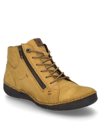 La bota de color mostaza está hecha de cuero y tiene un cordón como cierre. Las características especiales son la cremallera lateral y las costuras en contraste.