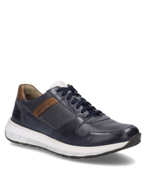 The sneaker in the color "ocean-multi" features a smooth dark blue upper with brown accents at the heel. It is equipped with lacing and has a white profiled sole for added comfort.