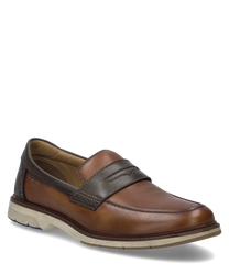 De slipper in camel-combinatie toont een elegante combinatie van lichtbruin en donkerbruin leer. Bijzondere kenmerken zijn de comfortabele elastische sluiting en de contrasterende lichte zool.