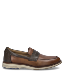 De slipper in camel-combinatie toont een elegante combinatie van lichtbruin en donkerbruin leer. Bijzondere kenmerken zijn de comfortabele elastische sluiting en de contrasterende lichte zool.
