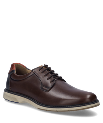 El zapato en la variante de color Castagne-Multi está hecho de cuero de alta calidad y cuenta con un clásico sistema de cordones. Las características especiales son la suela contrastante y la parte del talón en un color diferente.