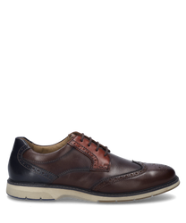 La chaussure basse dans la variante de couleur Castagne-Multi est fabriquée en cuir de haute qualité et dispose d'un laçage classique. Des caractéristiques particulières incluent les motifs de perforation décoratifs et la semelle contrastante.