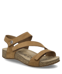 The sandal in the color nut is made of a smooth material and features a Velcro closure for easy on and off. The sole has a slightly speckled pattern that gives the shoe a unique look.