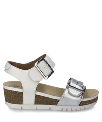 This sandal in silver combination features a practical Velcro closure and is characterized by its shiny silver upper material. The shoe has a comfortable sole with a cork look providing additional comfort.