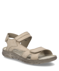 Beige sandal with Velcro closure. The sandal is made of leather and features visible seams that give the design structure.