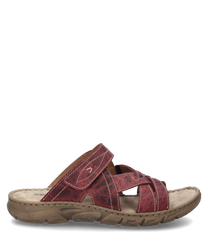 The sandal in the color orchid is made of a durable material with visible seams. It features a practical Velcro closure and a textured sole for better grip.