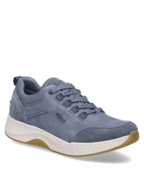 The sneaker is in a denim blue color and features lacing. The material combines smooth leather with breathable mesh inserts for optimal comfort.