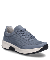 The sneaker is denim blue and features lacing. The material is perforated and the sole is white.