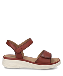 De sandaal in de kleur hibiscus is gemaakt van hoogwaardig materiaal en heeft een praktische klittenbandsluiting. De lichte gestructureerde zolen bieden extra comfort en stijl.