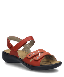 La sandalia es roja y cuenta con un práctico cierre de velcro. Tiene una suela cómoda y está adornada con elementos decorativos en las correas.